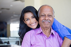 a man with his daughter after he sold his life insurance policy with retained death benefit