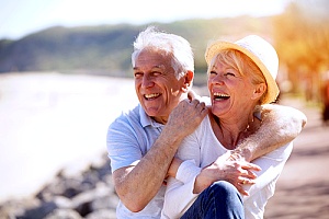 a senior couple enjoying time on the beach