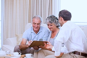 a life settlement provider reviewing investment opportunities with a couple