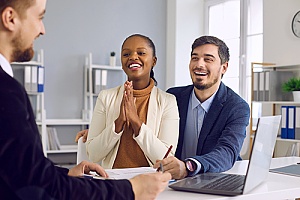 a woman learning about the life insurance process with her husband