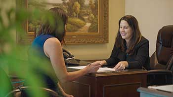 Ruth explaining life settlements to a client