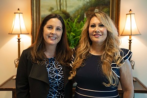 two female Montage financial group employees smiling